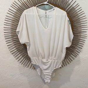 White, loose fitted bodysuit